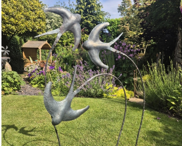3 metal sculpture swallows